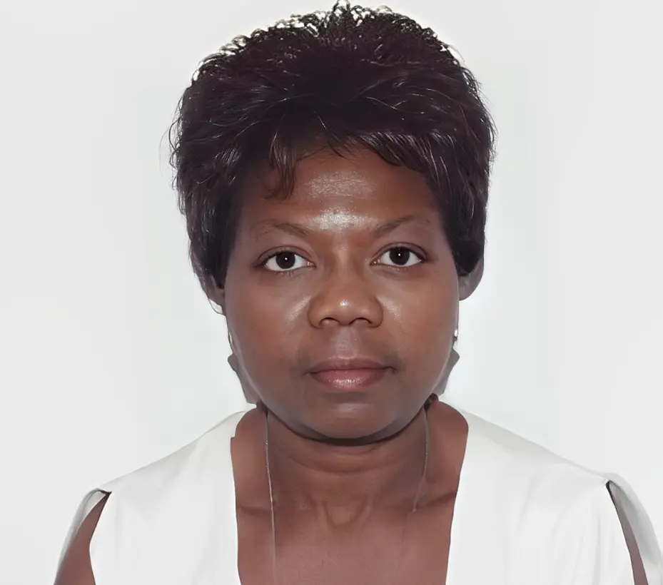 Woman in white top, short dark hair.